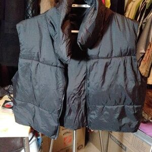 Black shorter vest huts the wast nicely. 23x18